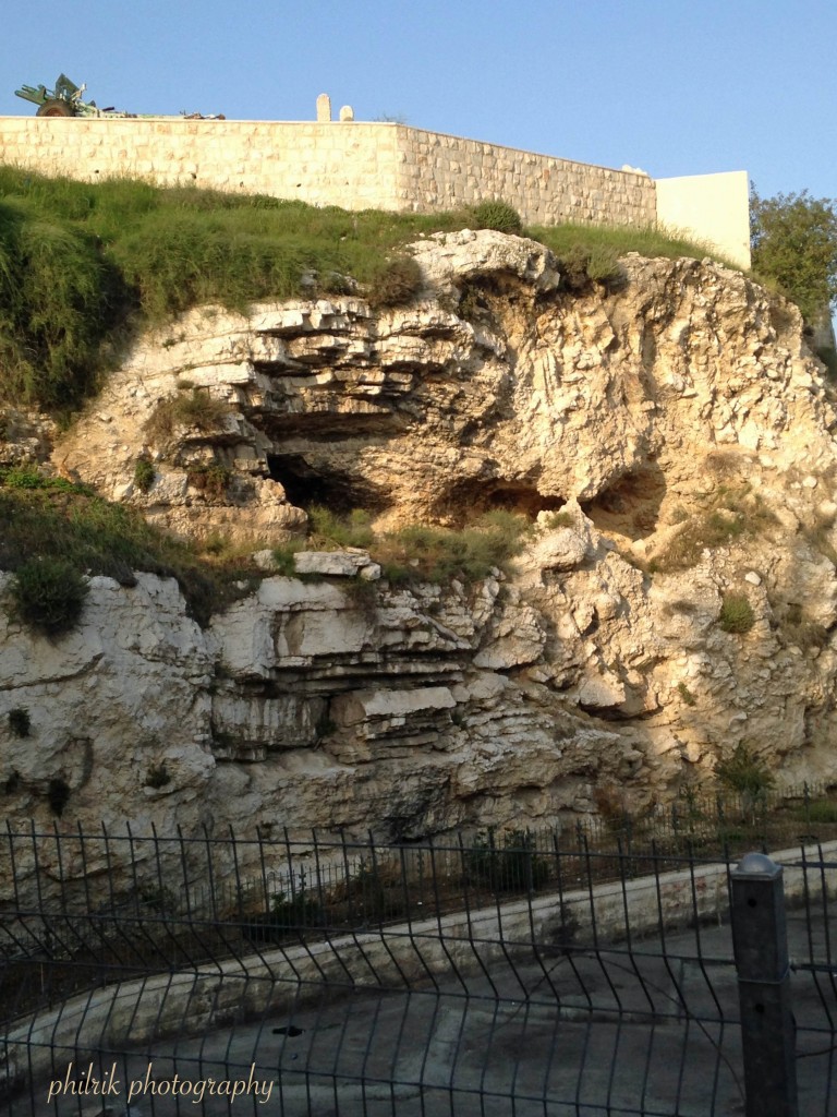 Some believe this is Golgotha, the Place of the Skull, due to its resemblance of a skull as well as its location outside the city walls where three roads converge to enter the city; a location of high visibility warning visitors to Jerusalem not to break the law. 